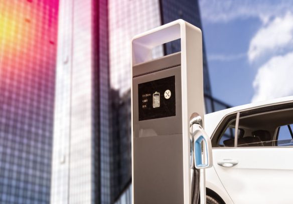 91547502 – e-car at a charging station in front of a skyscraper